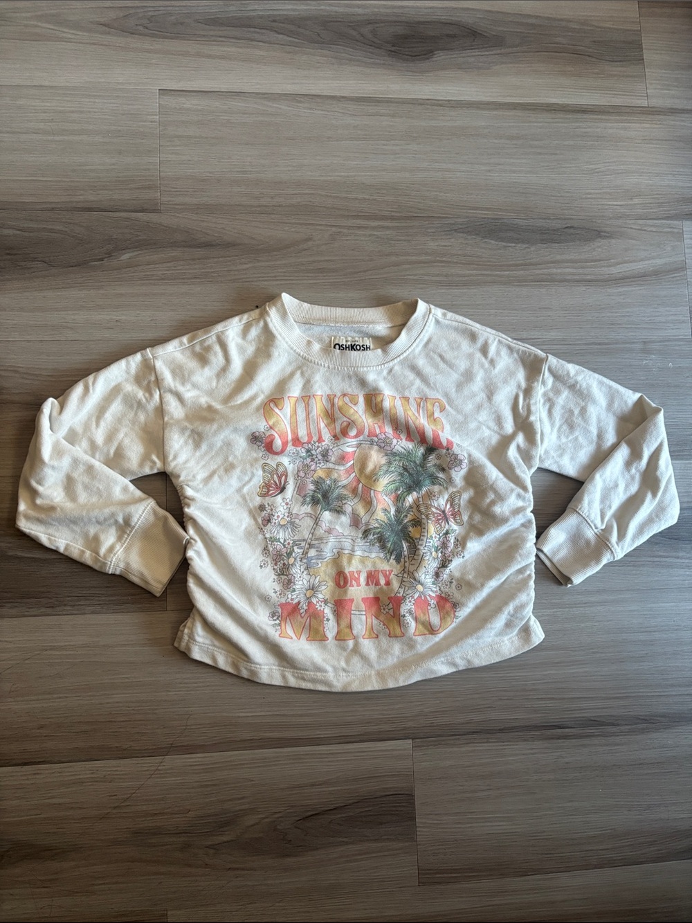 OshKosh B'gosh Cream long sleeve with Pastel Sunshine Graphic